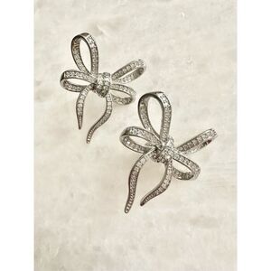 Silver color bow dangle earrings